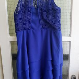 Gorgeous dress has so much detail to it.
3 subtle flouncy layers with folded pleats at the front. Top part has delicate intricate crochet lace type design, basque like insert with boning & detachable straps which are optional......I never used them!
Does up with concealed side zip & buttons at neck, shows off shoulders. 👗💙
*Dress is fully lined*

NB. photo 4 has a small mark on inside of lining & 5 on the back outside top layer, barely visible though.

Material: 100% Polyester
Dry Clean Only