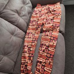 Reasonable offers would be considered.

African Print Silk Pants / Trousers.

Size 10
High waist, new without tags. 
Orange and Black pattern .