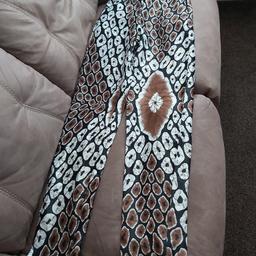Reasonable offers would be considered.

African Print Silk Pants / Trousers.

Size 10
High waist, new without tags. 

Brown and Black pattern .
