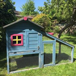 Outdoor hutch for rabbit or Guinea pigs, tray pulls out for easy cleaning. Sleeping area can be closed, 2 front door openings. Height 100cm, length 140cm, width 63cm.