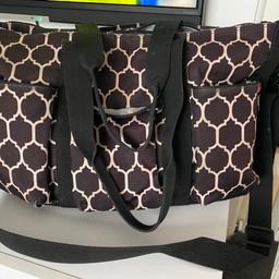 Over shoulder or handbag type changing bag. Very good storage space. Ideal for twins. Has compartments inside the main zipper part then another zipper part ideal for change of clothes. 3 outside pockets with 2 storage spaces on either side for bottles etc. can send more pics if required. Good condition