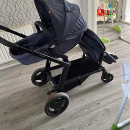 Mothercare Genie
Navy
Double/single pushchair 
Excellent condition 

Includes carrycot lining to turn either seat into a carrycot
Liner
2 footmuffs
2 raincovers

Top seat reclines 3 times so perfect from birth to toddler

My toddler is 2 & size of a 3 year old & fits perfect in front seat & top seat. 

Only thing wrong is the recline button is slightly ripped but can not be seen if covered (see pics) 

All been cleaned ready to be used straight away 

100 or nearest offer as need gone as soon as