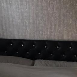 Black faux leather headboard with diamanté button effect for a double bed. (**Does not include the bed**)

Height 66cm (26”)
Fits a standard 4ft 6” bed via wood struts.

Only 5 months old and still in perfect condition! Only selling because our bed broke and ordered a new bed and got a king size so this headboard doesn’t fit our new bed.

Collection only

Paid £106.99 for it.

From smoke free/pet free home