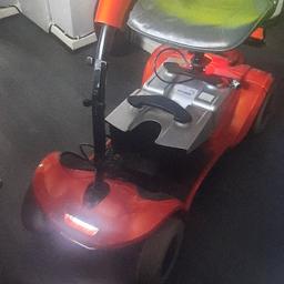 mobility scooter with two batterys charger csn be folded diwn go go in car ect.works great diffrent modes if speed some wear and tear but nit major .ls14 area can deliver for extra fuel like.