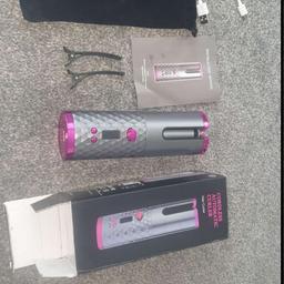 Automatic hair curler  ( NEW ) can be changed from  plug or phone charger, left & right curles 
unwanted  present  free post