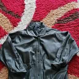 black real leather jacket. in excellent used condition
