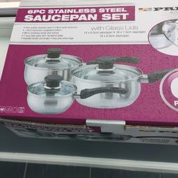 Pan set with glass lids used once still like new