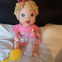 Talking laughing baby alive doll comes with brush and bottle. I will combine postage if more than one item is purchased. please message before purchasing for details.