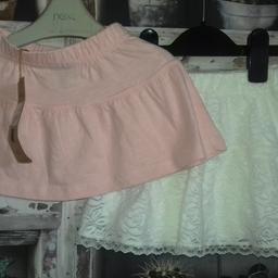 THIS IS FOR A BUNDLE OF GIRLS CLOTHES

1 X CREAM LACE SKIRT FROM UNITED COLOURS OF BENETTON
1 X PINK SKIRT FROM VILLA HAPP 

PLEASE SEE PHOTO