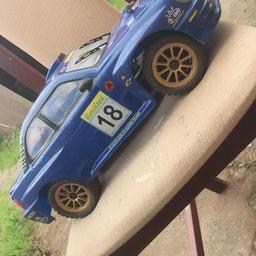 Petrol rc car i braught for my son but hardly gets used he lost interest comes with fuel 2 remotes 2 glow plug and charger also got couple other bits and bobs in with it aswell  collection or delivery if local