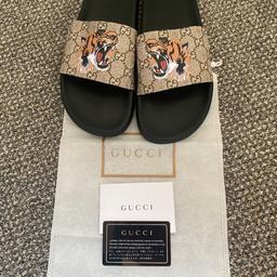 Brand new pair of Tiger Print Slides. These were given as a gift but are too large. Box was damaged in storage- selling with the slider, dustbag and card.
Grab yourself a bargain.