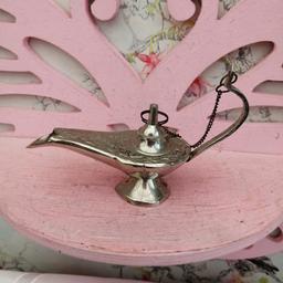 Cute, miniature, silver metal Genie lamp.

Please check out my other items and can post and combine postage for multiple buys 😊