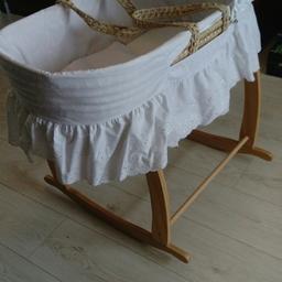 Broderie Anglaise moses basket from Boots with Clair de Lune wooden rocking stand from Mothercare. It is in immaculate condition, used only as an occaaional spare. From a pet free and smoke free home. Collection only please. 