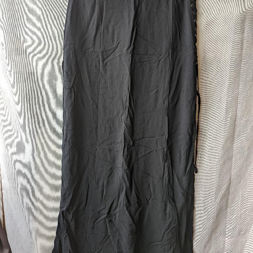 Forever 21 long black skirt maxi double split with crossed details. It comes with a shorter layer underneath. 100% rayon, not stretchy. Worn once, basically brand new.