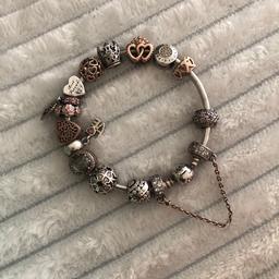 Used Pandora Bangle with charms and safety chain. Selling as i no longer wear it.