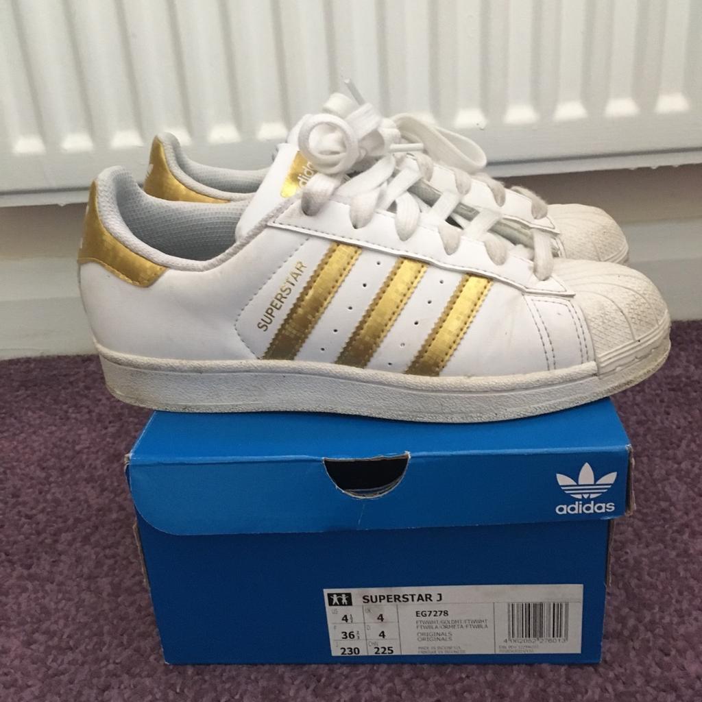 Superstar gold and white adidas trainers size 4. Very good condition