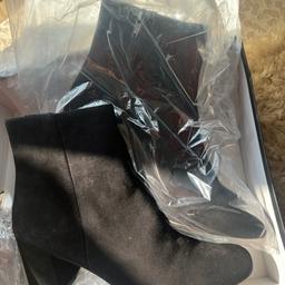Brand new in box. Black suede with a block heel 
Ankle boot. £140 new