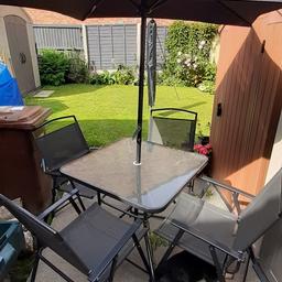 Lovely glass, square table and 4 chairs Used but Good condition. Been stored outside but under cover.
Only had 1 year paid £140 bargain at £80 ONO will consider sensible offers. comes with brolly cover .