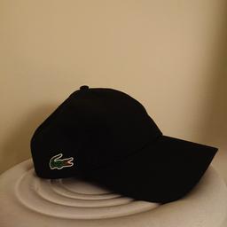 Adjustable black Lacoste cap. Brand new never worn. From a smoke and pet free home. Collection from Darwen or can deliver locally for £5.