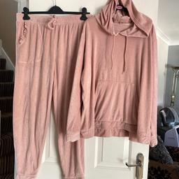 Pink velour tracksuit. Top size 20-22 bottoms 16-18from george