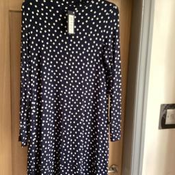 Marks &Spencer 
Ladies dress
Navy blue with white polka dots
Long sleeves
Knee length 
Stretch material 
Brand new with tags 
Will post for an extra £3.30