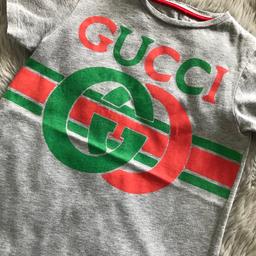 Gucci  T-shirt age 6 yrs. Good condition and from pet and smoke free home. Labels removed as grandson found them irritating.