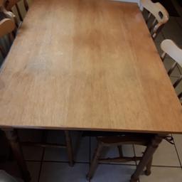 teak solid wood table and 4 chairs. covers included. size 31.5 inches x 47 inches.