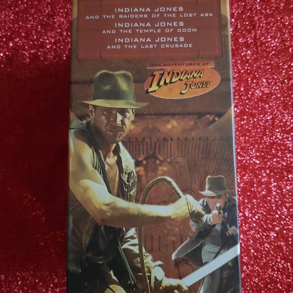 The Adventures of Indiana Jones VHS boxset issued by Lucasfilm in 2000. Includes The Temple of Doom, Raiders of the Lost Ark, and The Last Crusade. All videos play fine and box and cases all in good condition. As well as free collection from us, we also offer UK postal delivery for £2.99.