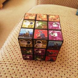 This is a collectors item. Genuine Wall-E Rubix cube in excellent condition .
