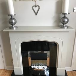 Complete fireplace 
Electric fire with LED flame effect with various heat settings 
Wooden beige surround with black sparkle solid hearth and backplate 
Very heavy and will need two people to carry 
Comes apart for easier transportation