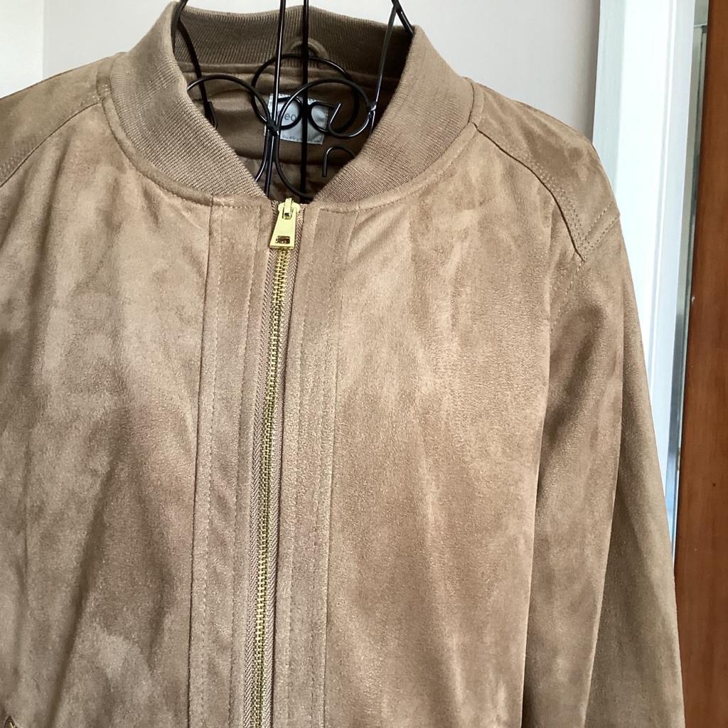 Bomber jacket
Size 16
Camel colour
Brush cotton outer
Metal zip front and pockets
Stud flap false pockets
Elasticated waist,cuffs and neck rib
Lightweight quilted padding inside
15” long from underarm to hem
collection or postage available