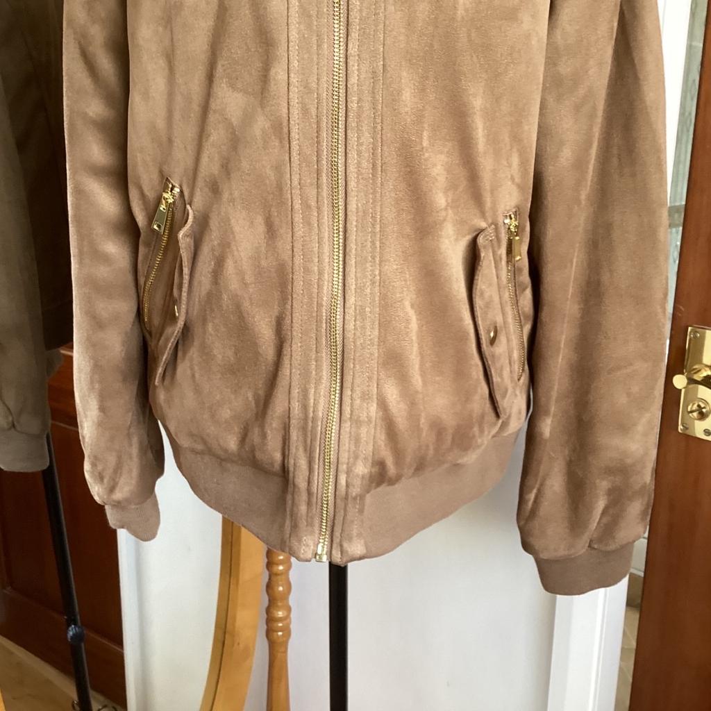 Bomber jacket
Size 16
Camel colour
Brush cotton outer
Metal zip front and pockets
Stud flap false pockets
Elasticated waist,cuffs and neck rib
Lightweight quilted padding inside
15” long from underarm to hem
collection or postage available