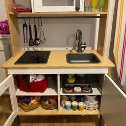 IKEA wooden play kitchen. Few years old but in great condition. Comes with everything pictured: IKEA cooking and tea sets, fabric food and some Melissa and Doug wooden baking sets. Kitchen hob has working light-up hob rings.
Fabric items have been machine washed, other items have been antibac cleaned or washed up. Kitchen itself has been antibac cleaned.
Some tea set items missing or lost over the years but overall fabulous set of items in well looked after condition, allowing little ones to get straight into playing chef and tea party!
Everything tidies up nicely into the kitchen itself.
Money raised is being donated to charity. All sensible offers considered. Collection only please.