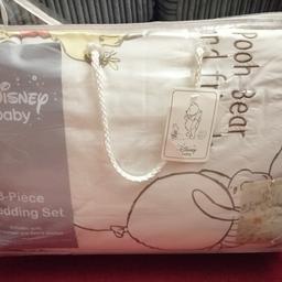 Brand new winnie the pooh bedding set complete with cot bumper, quilt and fleece blanket. Never been taken out of the packaging but zip to the bag is broken.