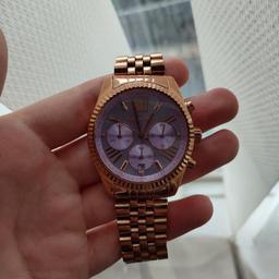 stunning genuine authentic Michael kors watch with a purple face. this was bought in America. needs a new battery