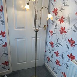 Floor lamp in a bronze color 3 lamps light stand all in working order. 5ft 2in or 158cm high. Good condition.