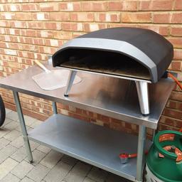 fab Ooni pizza oven with stainless Steel pizza stand plus pizza paddle, used a few times, fab condition and makes amazing pizzas.