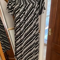 Slip on summer dress
On off shoulder style
short loose sleeves 
2” elasticated ribbed neck
Loose fitting
Size M 12/14
Black and white
28” long
From George
Collection or postage available