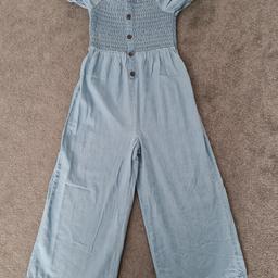 Girls lightweight, wide leg, denim jumpsuit. Next age 8yrs.  Great condition.  Free collection or can post for additional postage fee of £2.00.