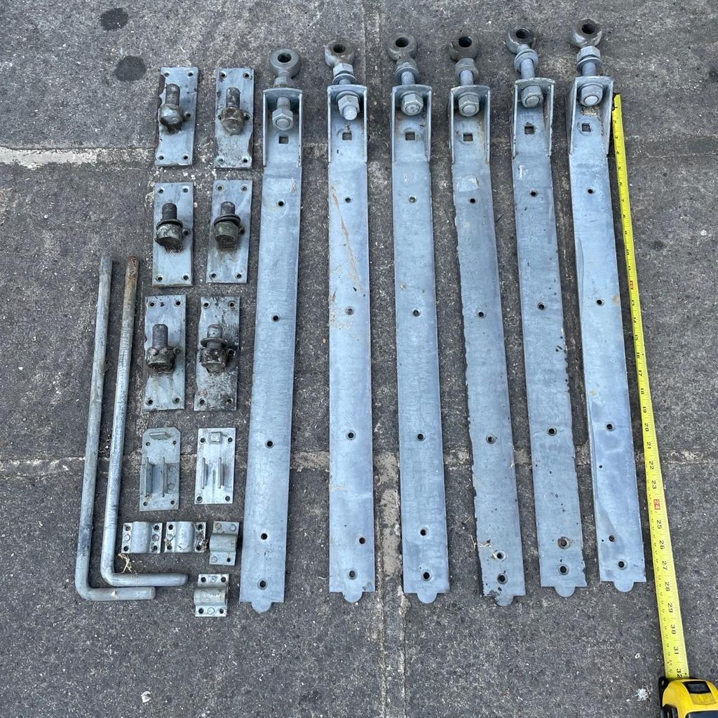 6 large galvanised adjustable hinges with 2 gate bolts. Approximately 28 inches long. Ideal for large gate or garage doors.
