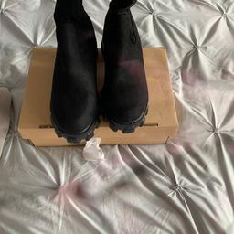 (PLEASE NOTE BLACK AND PINK LINES ARE FROM MY BROKEN CAMERA LENS NO DEFECTS TO ITEM! THANK YOU)

New in box. Black suede. Too big for me. Brought from ASOS.