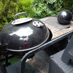 used charcoal kettle bbq on wheels good working order selling as i bought a new one rrp price £145 .. has bottle opener and granite chopping board built in.. is slightly rusty due to been out in the garden ..