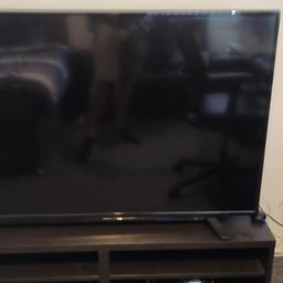 Toshiba smart 55 inch tv with stand and remote the screen has some scratches on top left from moving it but don't affect the screen when on