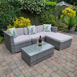 Outsunny rattan garden L shaped sofa with matching table and grey cushions.  Including heavy duty fitted cover. Only 2 years old. No damage at all. W 220cm x D 150. COLLECTION ONLY FROM B91 SOLIHULL AREA (does come apart for transportation).