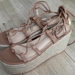 Brand new, unworn Boohoo flatform, tie up sandals in size 8. Nude colour.