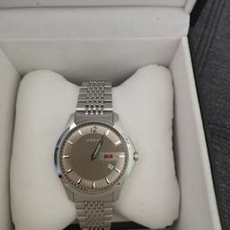 real lovely watch, comes with certificate and box. been worn once still like brand new. rrp £699