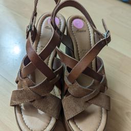 Beautiful wooden wedge sandals with suede strings, made in Italy. Never worn.