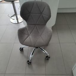 Grey chair, very comfortable with adjustable hight seat. Some small stains which can be early removed from the fabric.