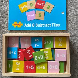 Wooden numeracy tiles, answers on the reverse of each tile. Can play independently.