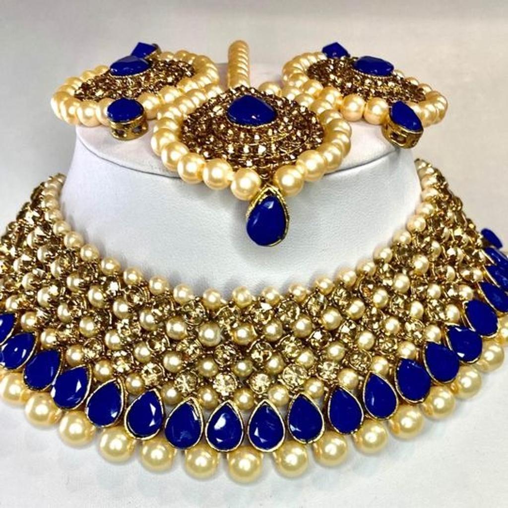 This beautiful 3 piece Choker Necklace, Earrings & Headpiece set is perfect for any Occasion. This amazing set is Gold Plated and filled with Bronze and Royal Blue Stonework. As the Jewellery is made from Zinc this is a durable material which will not discolour or corrode.
Care Instructions: Keep away from Water, Body Lotions and Perfumes